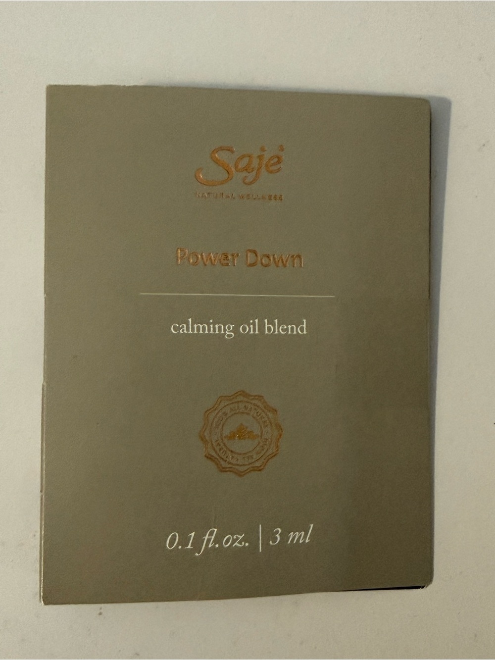 Saje Power Down Calming Oil Blend - Olive Green with Gold Lettering